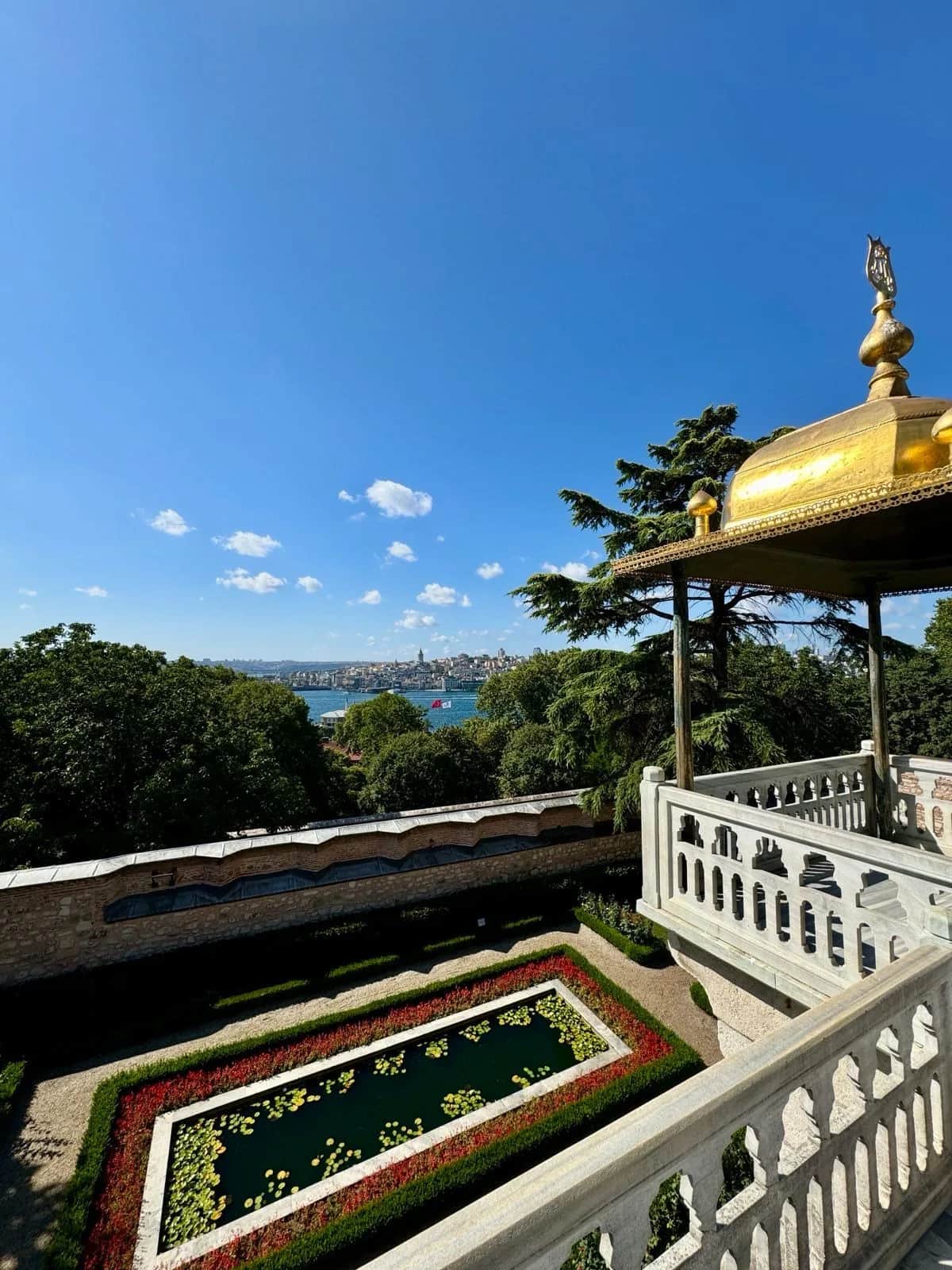 Gilded canopy and marble balustrade above a garden pool at an Ottoman palace, Istanbul 2024