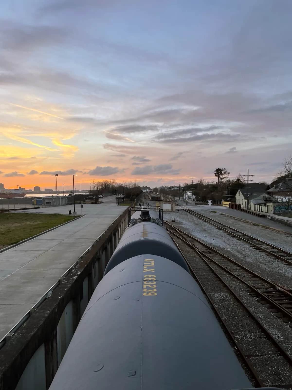 Tank cars standing on the riverside tracks at sunset in the Bywater, New Orleans 2021