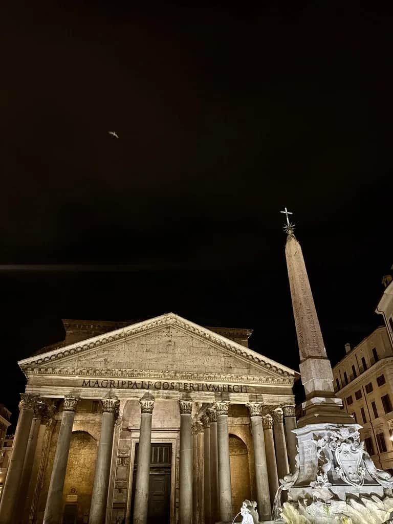 The Pantheon and the obelisk fountain lit against a black sky, Rome