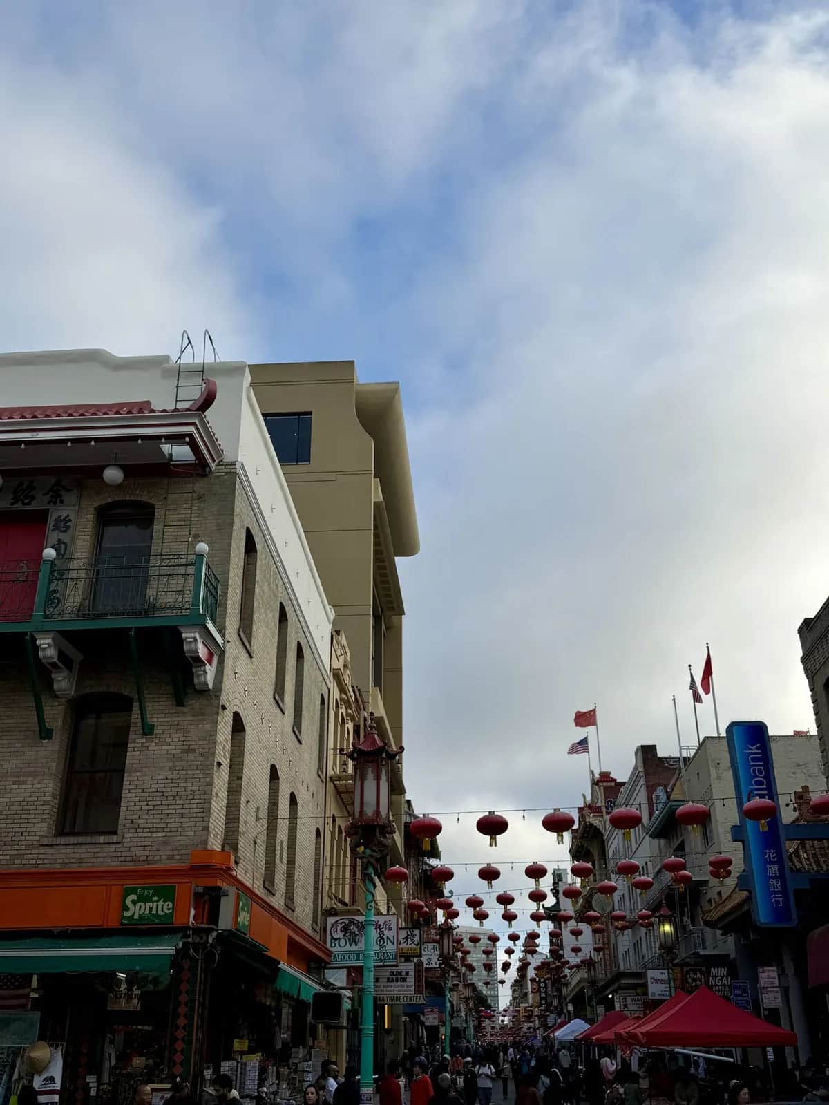 Red lanterns strung the length of the street under a clouded sky, Chinatown San Francisco